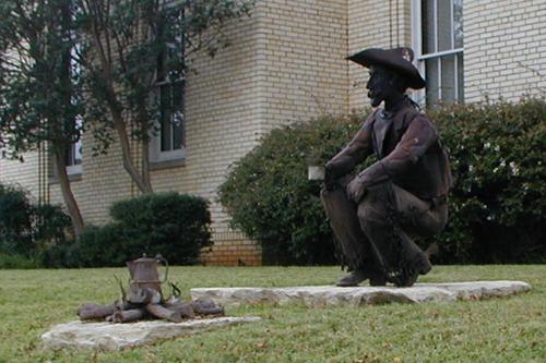 Statue of cowboy drinking coffee, Graham Texas